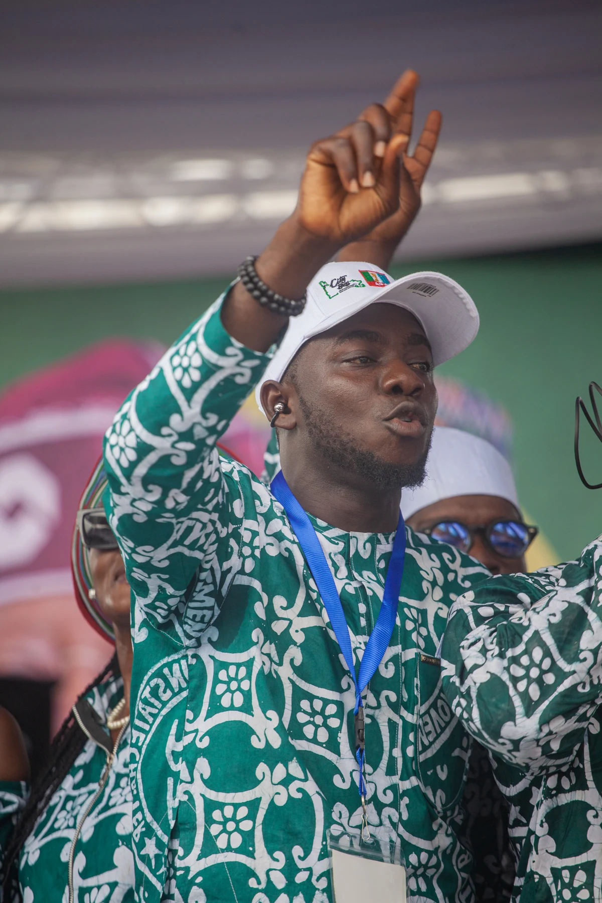 An attendee raising a hand during the CBM Ogun inauguration